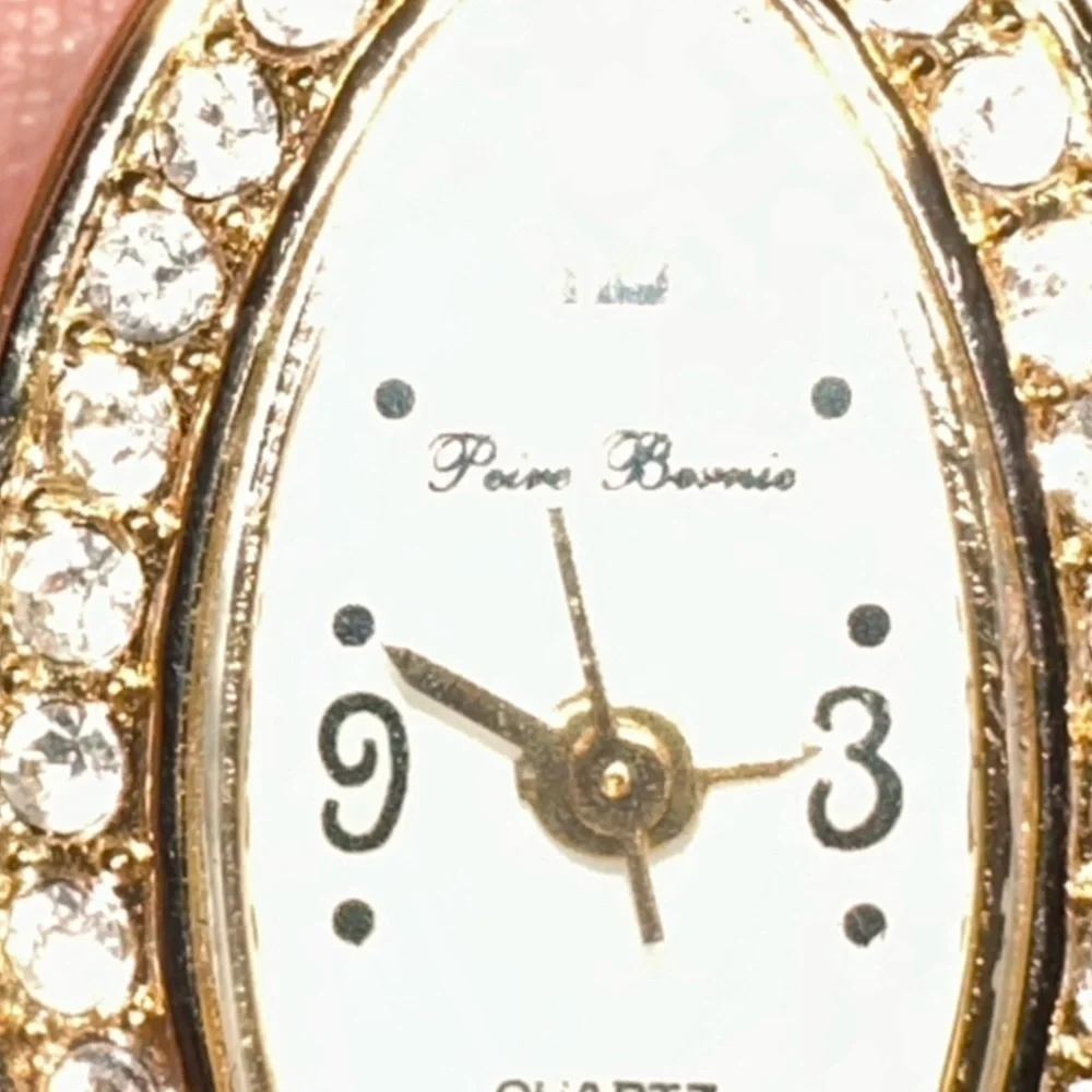 Peire Bernie oval shape Goldtone and Rhinestone women’s watch.